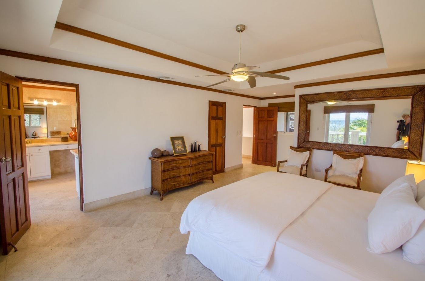 Bedroom 1 at Casa Guacalito featuring an ensuite bathroom and oceanview balcony.